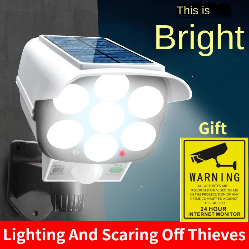 Home Security Video Cameras - 屋外ソーラーライトモーションセンサーセキュリティダミーカメラワイヤレスフラッドライトIP65防水77 LEDランプ3モード家庭菜園用